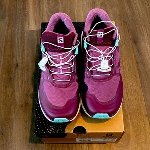 Salomon Women's Ultraglide.
Size 7, but fits like 7.5. 
New in box, never worn.